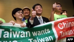 台灣衛生福利部部長陳時中（中）率團到日內瓦在世界衛生大會的場外發聲。（法新社2018年5月21日）