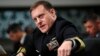 FILE - U.S. Cyber Command and National Security Agency Director Admiral Mike Rogers testifies on Capitol Hill in Washington before the Senate Armed Services Committee, May 9, 2017.