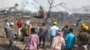 Rescue personnel and local residents gather near a firecracker plant following an explosion at Harda district in India's Madhya Pradesh state on Feb. 6, 2024.