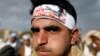 FILE - A Houthi supporter wears a headband praising the Houthi movement for making drone aircraft as he attends a pro-Houthi rally in Sana'a, Yemen March 3, 2017. 