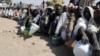FILE - Internally displaced persons wait to be served with food at Dikwa camp, in northeast Nigeria's Borno state, Feb. 2, 2016. The U.N is hoping to raise $1 billion to meet the needs of nearly seven million victims of the Boko Haram insurgency in northeast Nigeria.