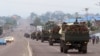 FILE - Congo military trucks carrying Congolese troops drive in a main street after violence erupted due to the delay of the presidential elections in Kinshasa, Democratic Republic of the Congo, Sept. 20, 2016.