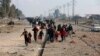 Displaced Iraqis, who fled fighting between Iraqi security forces and Islamic State militants, return to their homes in neighborhoods retaken by Iraqi government forces in the eastern side of Mosul, Iraq, Jan. 4, 2017. 