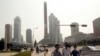 People wearing masks make their way in the Ryomyong street in Pyongyang, North Korea Friday, July 3, 2020. North Korean leader Kim Jong Un urged officials to maintain alertness against the coronavirus, warning that complacency risked “unimaginable…
