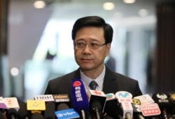លោក John Lee រដ្ឋមន្ត្រី​ទទួល​បន្ទុក​ផ្នែក​សន្តិសុខ​របស់​ហុងកុង​ ប្រកាស​ពី​ការ​លុបចោល​ច្បាប់​បត្យាប័ន​នៅ​ក្នុង​ក្រុង​ហុងកុង កាលពី​ថ្ងៃទី២៣ ខែតុលា ឆ្នាំ២០១៩។