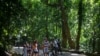 Visitors stroll and pedal at the Tijuca National Park in Rio de Janeiro, Feb. 28, 2021. 