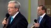 Opposition leader Tony Abbott (R) listens to Australian Prime Minister Kevin Rudd during the People's Forum in Sydney, Aug. 28, 2013. 