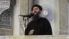 FILE - An image made from video posted on a militant website July 5, 2014, purports to show the leader of the Islamic State group, Abu Bakr al-Baghdadi delivering a sermon.
