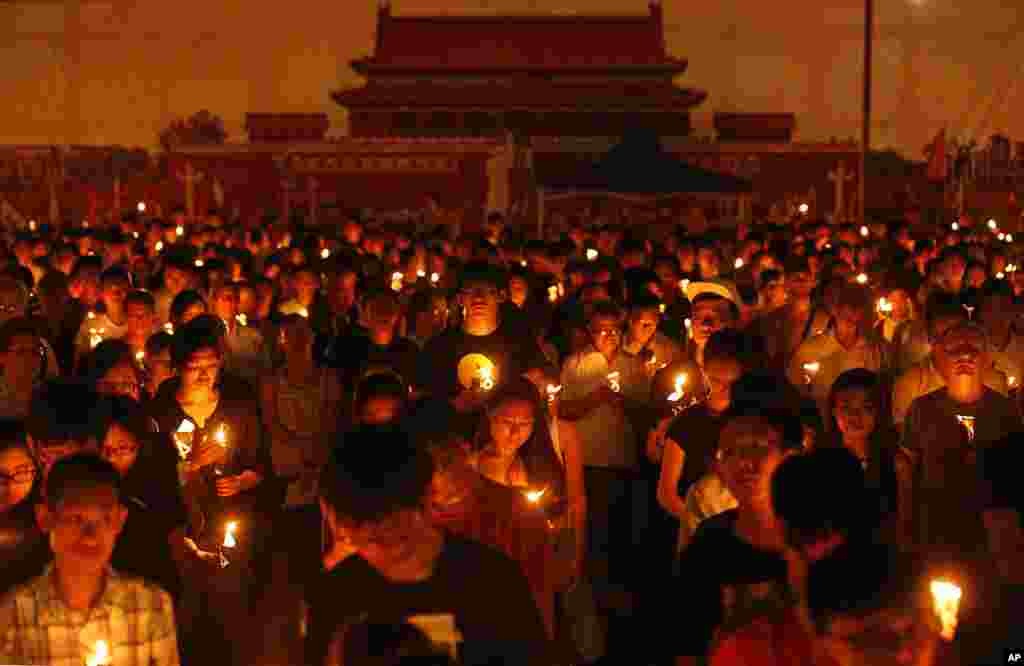 Tens of thousands of people attend a candlelight vigil at Victoria Park in Hong Kong to mark the 25th anniversary of crackdown in Tiananmen Square, June 4, 2014.