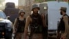 FILE - Soldiers return to the staging area after participating in a security operation on the outskirts of Peshawar, Pakistan June 24, 2017. Raza Rabbani, the chairman of the Pakistani Senate, upper house of parliament, denounces what he called U.S. President Donald Trump's policy of blaming Pakistan for failures of the United States in Afghanistan. 