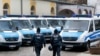 FILE - German police officers walk in front of a mosque during a terror raid in Frankfurt, Germany, Feb. 1, 2017. 