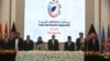 Afghan President Ashraf Ghani, center, and delegates stand for the national anthem during the second Kabul Process conference at the Presidential Palace in Kabul, Feb. 28, 2018. 