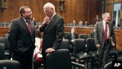 FILE - Brian Benczkowski, Senate Judiciary committee minority staff director, left, talks with committee chairman Sen. Patrick Leahy, D-Vt. on Capitol Hill in Washington, June 11, 2009.