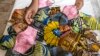 FILE - Handmade face masks made from African fabric are seen in Yaoundé, April 23, 2020. Police are arresting Cameroonians not wearing protective face masks to protect against COVID-19.