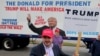 Bob Bolus, a supporter of U.S. Republican presidential candidate Donald Trump, gives the thumbs up to drivers as they pass by on Super Tuesday in Middleburg Heights, Ohio, March 15, 2016. 
