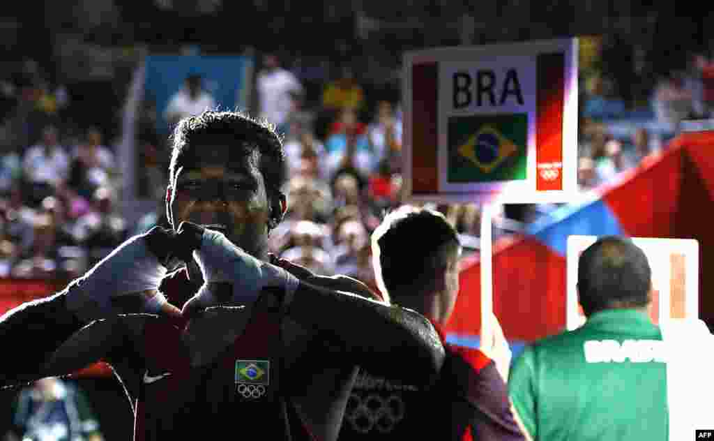Yamaguchi Falcao Florentino of Brazil exits the ring victorious over Fanlong Meng of China in their round of 16 Light-heavyweight (81kg) match of the London 2012 Olympic Games
