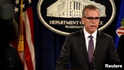 FILE - FBI Deputy Director Andrew McCabe holds a press conference in Washington, July 20, 2016. McCabe is among a handful of candidates being considered for acting director.