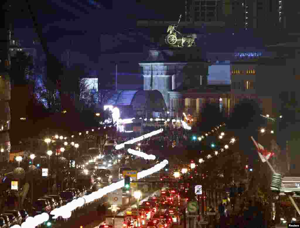 The installation 'Lichtgrenze' (Border of Light) along a former Berlin Wall location is illuminated near the Brandenburg Gate in Berlin, Nov. 7, 2014.