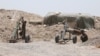 Fighters of the Syria Democratic Forces prepare to fire a mortar shell towards positions held by Islamic State fighters in northern province of Raqqa, Syria, May 27, 2016.