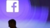 FILE - Facebook CEO Mark Zuckerberg walks at the company's headquarters in Menlo Park, Calif., April 4, 2013. 