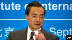 中國外交部長王毅在北京一個學術研討會上發表講話。