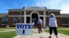 Voters arrive to cast their ballots during the Alabama Primary election at Huntingdon College in Montgomery, Alabama, June 5, 2018. 