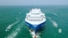 FILE - The Galaxy Leader cargo ship is escorted by Houthi boats in the Red Sea in this photo released Nov. 20, 2023. (Houthi Military Media via Reuters)