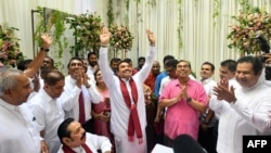 A scion of Sri Lanka’s Rajapaksa family, presidential candidate Namal Rajapaksa, center, gestures as he receives ticket from the Sri Lanka Podujana Peramuna (SLPP) party in Colombo on Aug. 7, 2024.