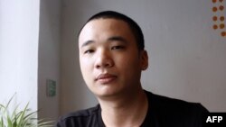 Nguyen Ha Dong, the author of the game Flappy Bird relax inside a coffee shop in Hanoi, Feb. 5, 2014.