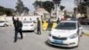 A member of Libyan security forces gestures after armed groups aligned with a U.N.-backed government took over a compound occupied by a self-declared rival prime minister in heavy fighting, in Tripoli, Libya, March 15, 2017. 
