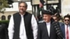 Pakistani Prime Minister Shahid Khaqan Abbasi is received by Afghan President Ashraf Ghani at the presidential place in Kabul, April 6, 2018.