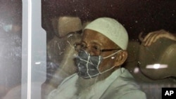 Islamic cleric Abu Bakar Bashir sits inside a van as he leaves upon his release from Gunung Sindur Prison in Bogor, West Java, Indonesia, Friday, Jan. 8, 2021. The convicted firebrand cleric who inspired the Bali bombers and other violent extremists…