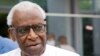 Lamine Diack (L), former head of International Association of Athletics Federations (now World Athletics), from 1999 to 2015, leaves the courthouse in Paris on June 10, 2020, during the midday break of his trial on charges of accepting millions of dollars
