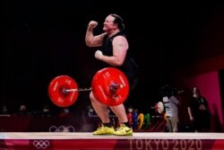 Laurel Hubbard of New Zealand reacts after a lift in the women's +87kg weightlifting event at the 2020 Summer Olympics, Aug. 2, 2021.