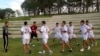 FILE - Palestinian football players warm-up during a training session at the Asian Games athletes’ village in Incheon, South Korea.