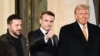 French President Emmanuel Macron gives a thumbs up as he is flanked by Ukrainian President Volodymyr Zelenskyy and U.S. President-elect Donald Trump after a meeting at the Elysee Presidential Palace in Paris on Dec. 7, 2024.