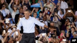 Le président Barack Obamaarrive lors d'un rassemblement au nord de Las Vegas, le 23 octobre 2016.
