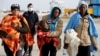 Migrants disembarks from Dattilo coast guard vessel in the Sicilian harbour of Augusta, Italy, Feb. 25, 2017.