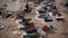 FILE - Ethiopian migrants sleep out in the open near a transit center where they wait to be repatriated, in the western Yemeni town of Haradh, on the border with Saudi Arabia. The U.N. refugee agency reports nearly 106,000 people, mostly from Ethiopia and Somalia, have risked their lives on the high seas to reach Yemen in 2016.