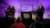 Australian Prime Minister and leader of the Australian Labor Party Kevin Rudd (L) speaks as the leader of the conservative opposition Tony Abbott listens on during their debate at the National Press Club in Canberra, August 11, 2013.