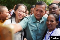 Hun Manet, son of Cambodia's Prime Minister Hun Sen is seen at a polling station on the day of Cambodia's general election, in Phnom Penh, Cambodia, July 23, 2023. REUTERS/Cindy Liu