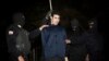 FILE - Iranian policemen prepare to hang a young convict in Tehran, Iran, Jan. 20, 2013. A new U.N. report says Iran has executed 73 minors in the past decade.
