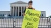 The Rev. Patrick Mahoney demonstrates as the U.S. Supreme Court announces decisions on Capitol Hill in Washington, June 21, 2024. The court upheld a law that prevents people who are subject to a restraining order for domestic violence from possessing firearms.