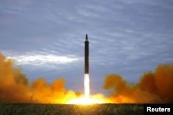 A missile is launched during a long and medium-range ballistic rocket launch drill in this undated photo released by North Korea's Korean Central News Agency (KCNA) in Pyongyang, Aug. 30, 2017.