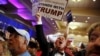 FILE - Supporters of U.S. Republican presidential candidate Donald Trump celebrate the close of the polls as they watch election results at a rally in Spartanburg, South Carolina, Feb. 20, 2016. 