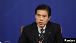中國商務部部長鐘山2018年3月11日出席記者會(路透社)