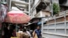 Evictees Begin to Leave Phnom Penh’s Crumbling ‘White Building’