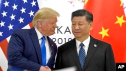 美國總統特朗普和中國國家主席習近平在G-20峰會握手（2019年6月29日）