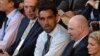 Australian of the Year 2014 Adam Goodes (C), attends the men's singles final match at the 2014 Australian Open tennis tournament in Melbourne on Jan. 26, 2014. 