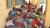 FILE - Nigerian refugees fleeing Boko Haram and deported by Niger troops rest after arriving in Gaidam, Nigeria, May 6, 2015. Since Friday, militants' attacks in southeast Niger have displaced 50,000 people there, UNHCR reports.